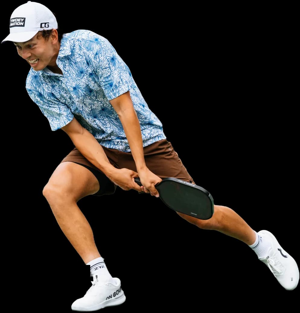 Connor Garnett lunging low for a backhand