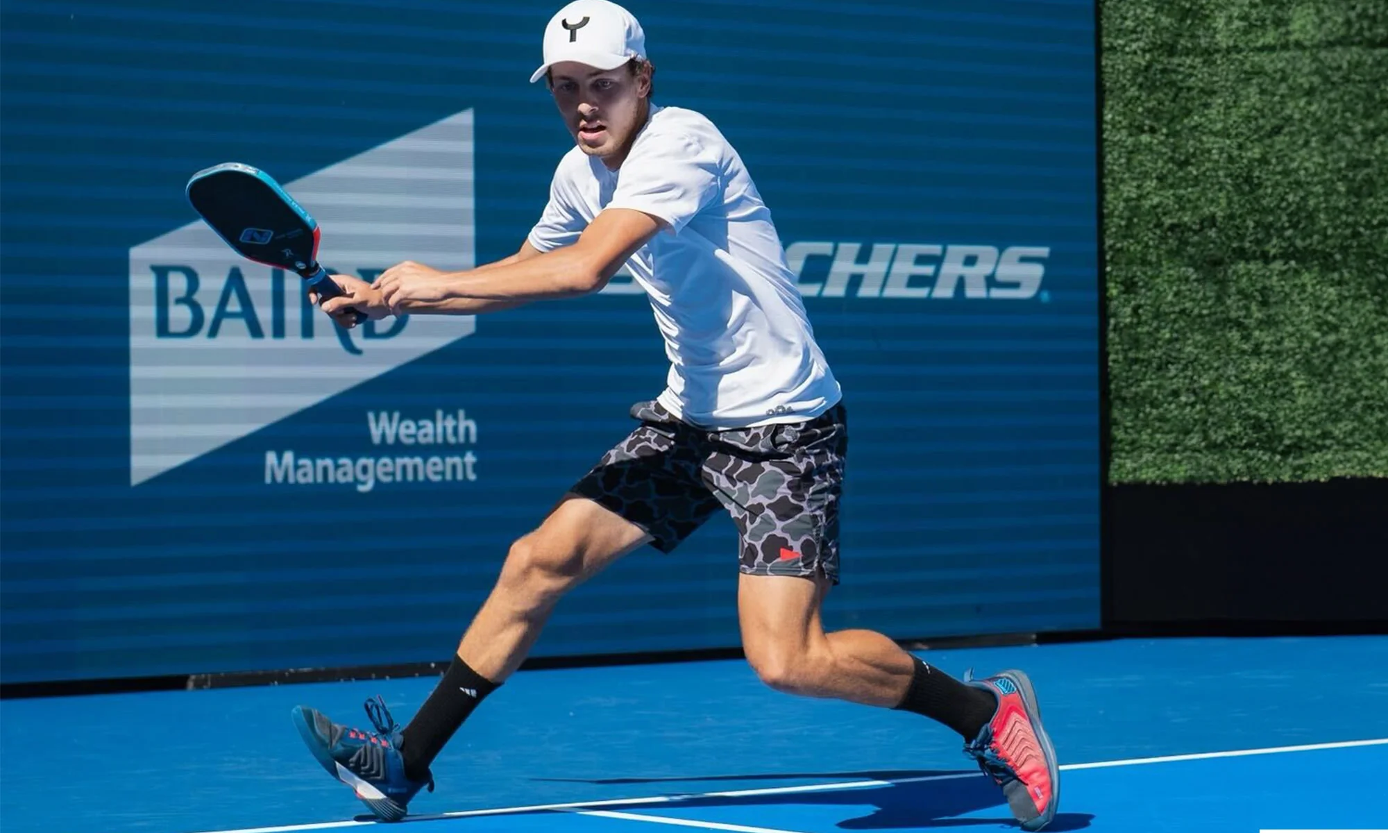 Connor Garnett on court holding a paddle
